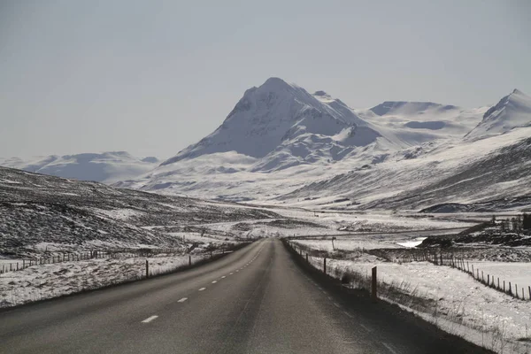 Road in Iceland. Landscape and road in winter, road trip on the country at Iceland. Beautifull nature of Iceland. Epic and majestic landsacapes. Route Number One (Ring Road).