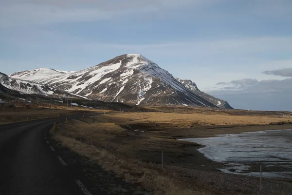 Road in Iceland. Landscape and road in winter, road trip on the country at Iceland. Beautifull nature of Iceland. Epic and majestic landsacapes. Route Number One (Ring Road).