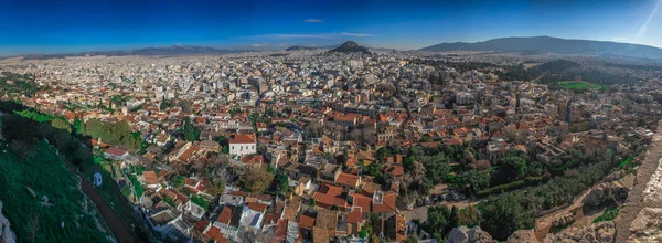 Acropolis of Athens, Greece, with the Parthenon Temple. Famous old Parthenon temple is the main landmark of Athens. View of Odeon of Herodes Atticus, Figures of the Caryatid Porch of the Erechtheion.