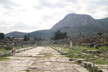 Ruins of Ancient Corinth in Peloponnese, Greece. Archaeology background, Temple of Apollo (6th c. B.C.) in Ancient Corinth, Ancient Greece. clipart