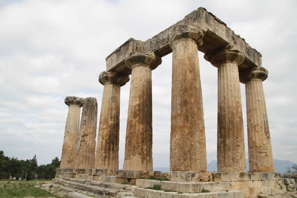 Ruins of Ancient Corinth in Peloponnese, Greece. Archaeology background, Temple of Apollo (6th c. B.C.) in Ancient Corinth, Ancient Greece.