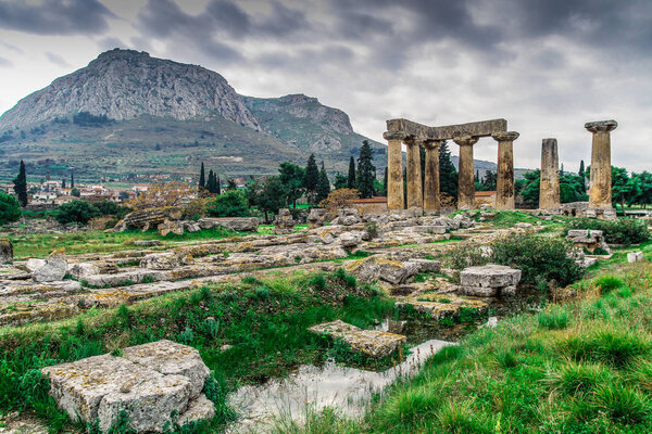 Ruins of Ancient Corinth in Peloponnese, Greece. Archaeology background, Temple of Apollo (6th c. B.C.) in Ancient Corinth, Ancient Greece.