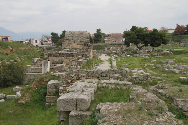 Ruins of Ancient Corinth in Peloponnese, Greece. Archaeology background, Temple of Apollo (6th c. B.C.) in Ancient Corinth, Ancient Greece.