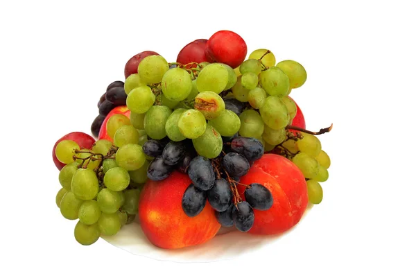 Grapes and peaches on a plate. — Stock Photo, Image