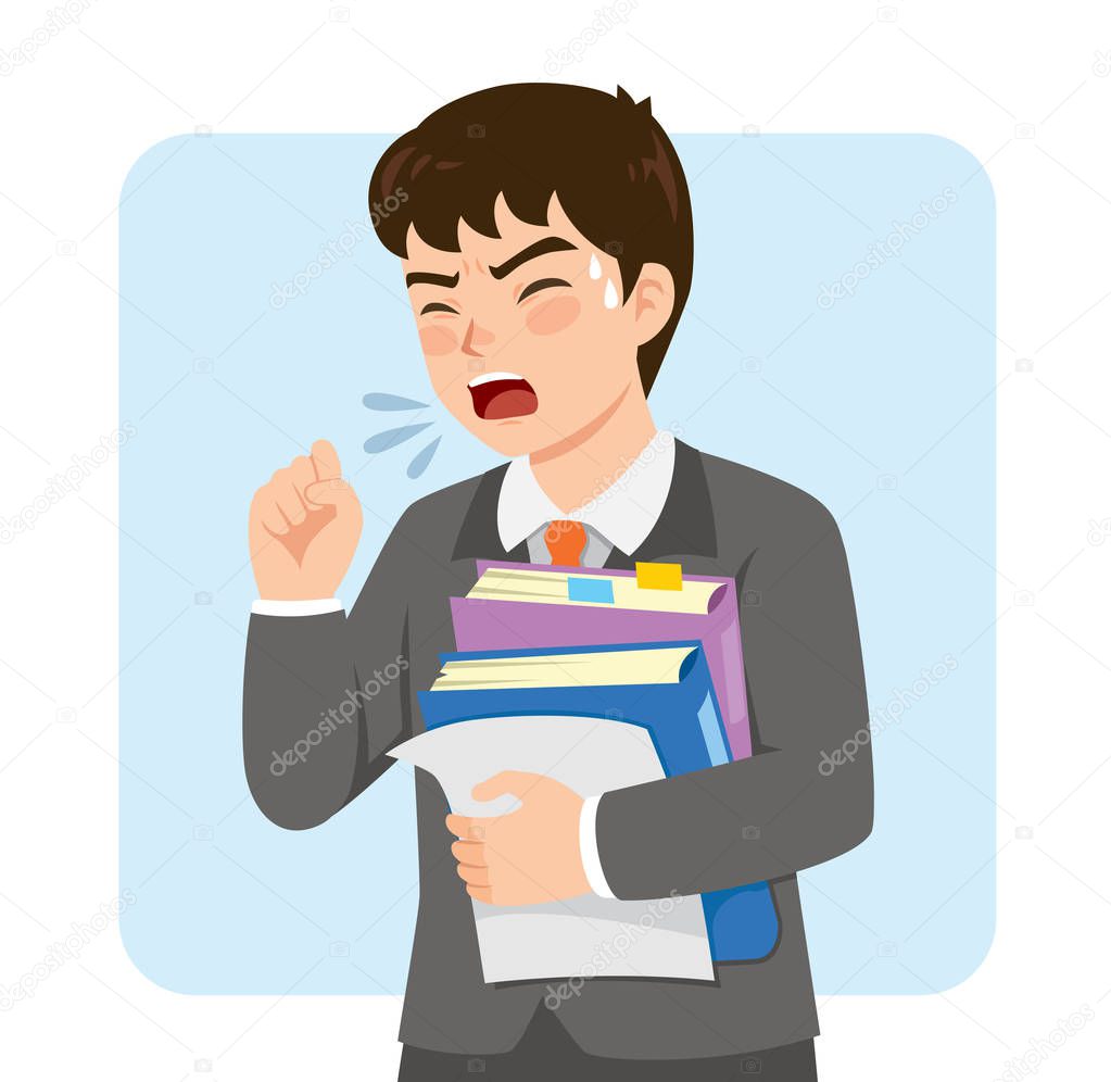 Young businessman in a suit coughing at work while holding office folders