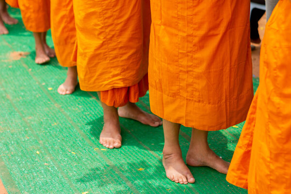 There was a merit making in the morning. People would scoop food into the alms of many monks.