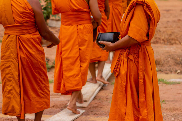 There was a merit making in the morning. People would scoop food into the alms of many monks.