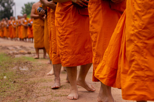 There was a merit making in the morning. People would scoop food into the alms of many monks.