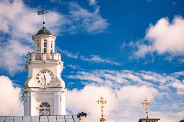 Beautiful old white tower of townhall in Vitebsk, Belarus, Europe. Blue cloudy sky in background. clipart