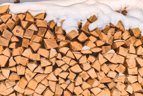 Pile of chopped lumber covered with snow — Stock Photo, Image