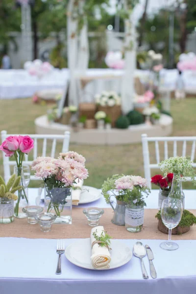 Outdoor catering dinner at the wedding with homemade garnishes decoration