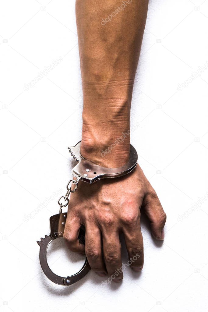Arm on white background with handcuff locked
