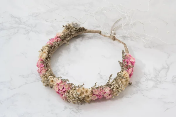 Flower headband on white marble background