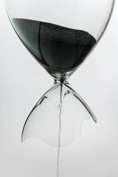 Broken Sandglass Black Sand Leaking Out — Stock Photo, Image