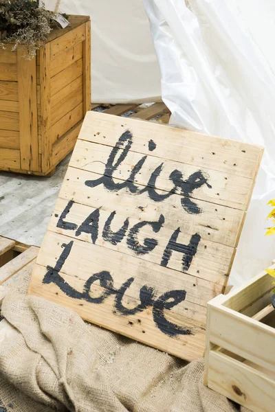 live laugh love sign on wooden board