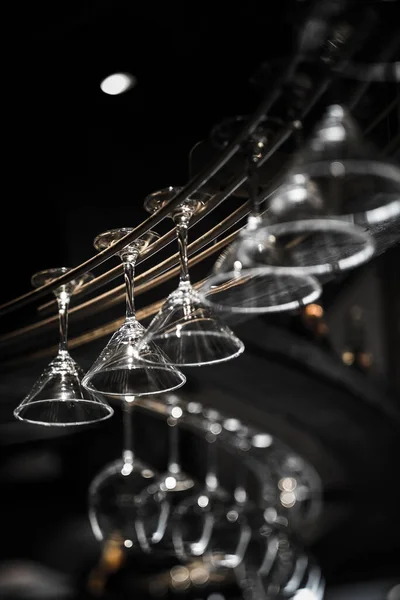 wine, glass, hanging, empty, rack, glasses, bar, group, drink, clean, transparent, alcohol, hang, set, restaurant, cocktail, upside, background, closeup, white, nobody, interior, indoors, objects, cafe, wineglass, pub, light, vintage, design, row, do