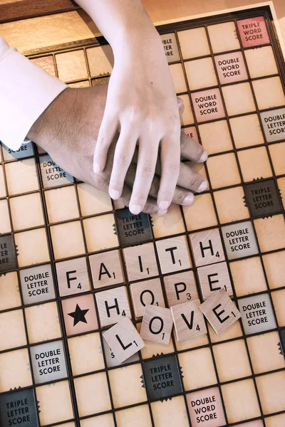 Wooden Letters Wording Board Game Says Faith Hope Love — Stock Photo, Image