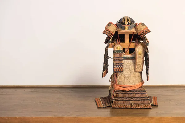 Old collectible samurai armor display in a room