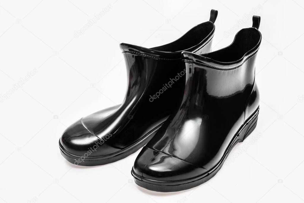 Black rubber waterproof boots isolated on white background