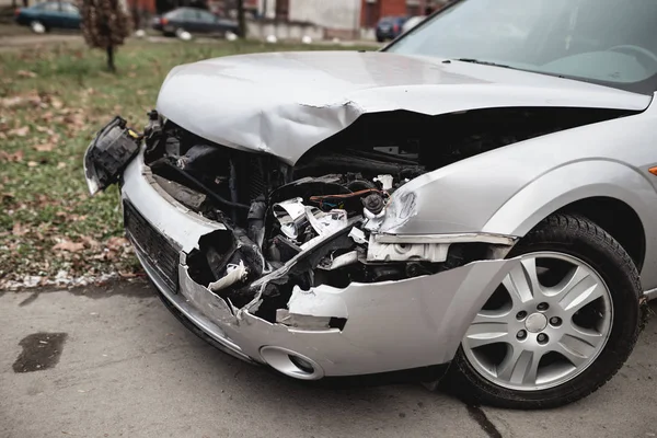 crashed car on the city street.