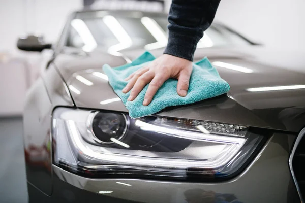 cleaner washing  car in the  car wash