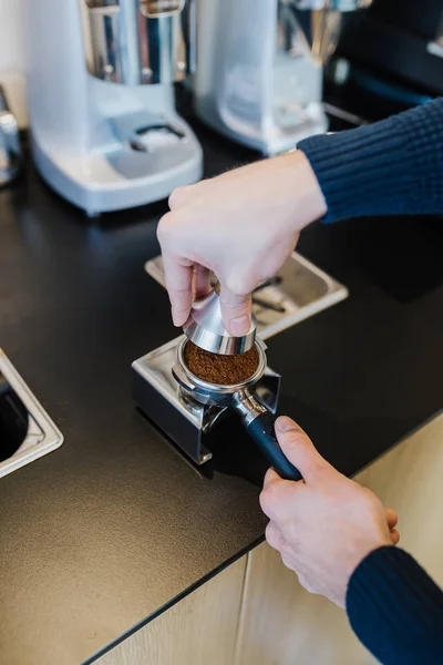 Man making coffee with coffee machine