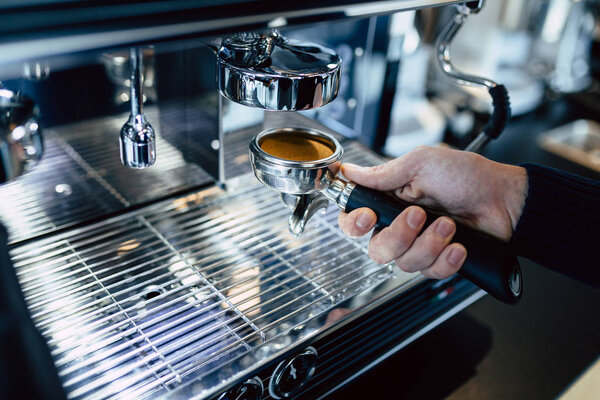 Man making coffee with coffee machine