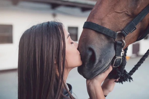 Beautiful Brunette Girl Kissing Her Horse Selective Focus — Stock Photo, Image