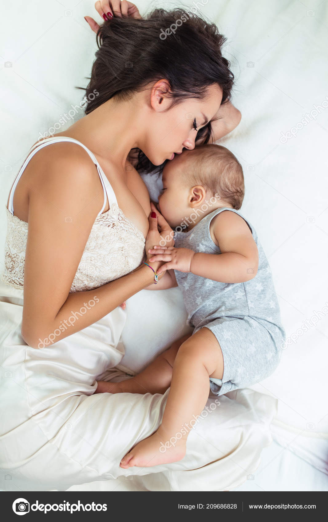 beautiful mother feeding baby