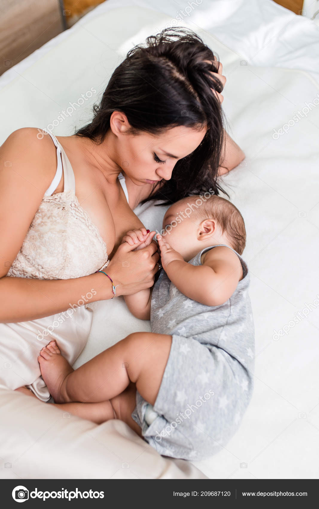 beautiful mother feeding baby