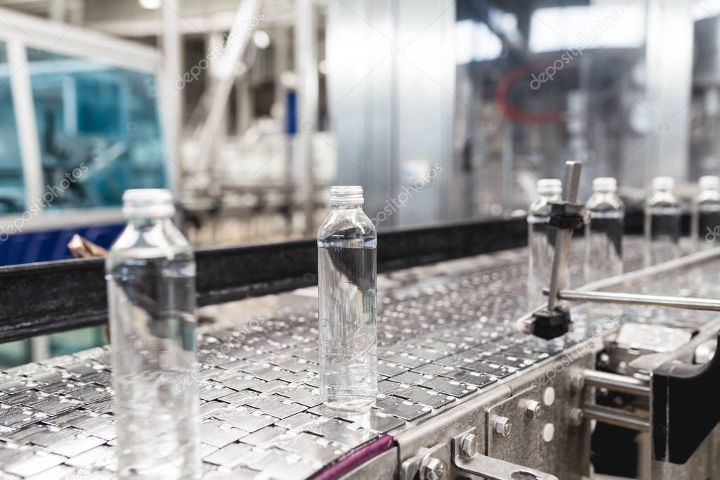 Bottling plant - Water bottling processing . Selective focus. 