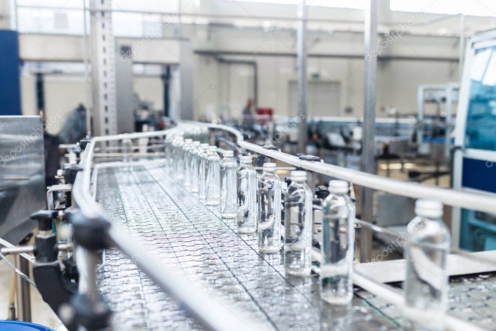 Bottling plant - Water bottling processing . Selective focus. 