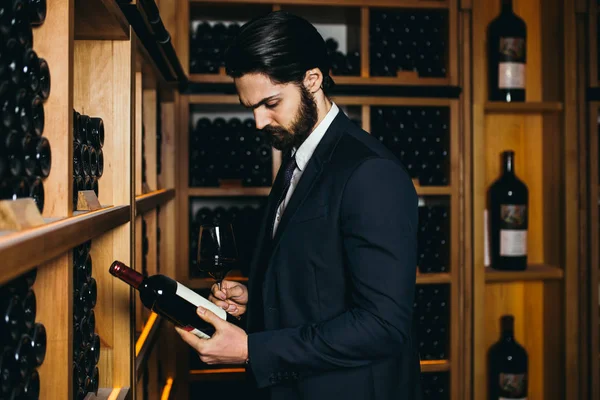 Young Sommelier Choosing Bottle Wine Wine Cellar — ストック写真