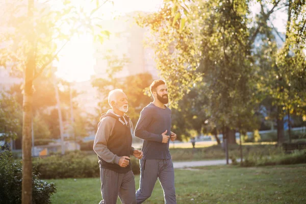 Happy Father Son Jogging Together Outdoors Park — Stock Photo, Image