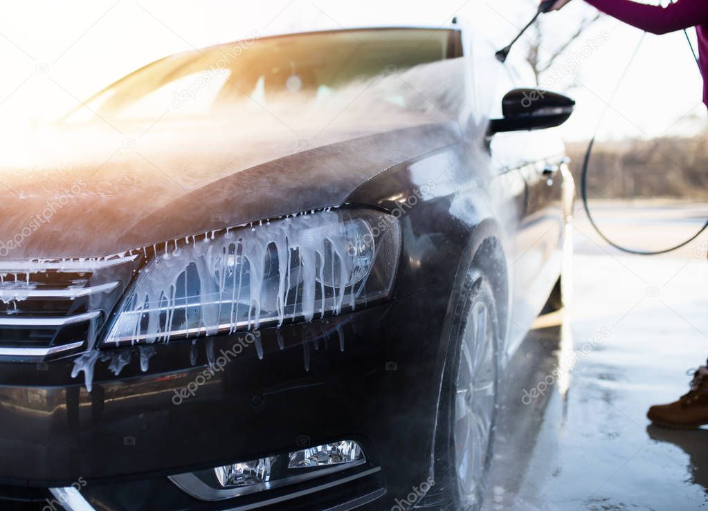 Car washing. Cleaning Car Using High Pressure Water. 