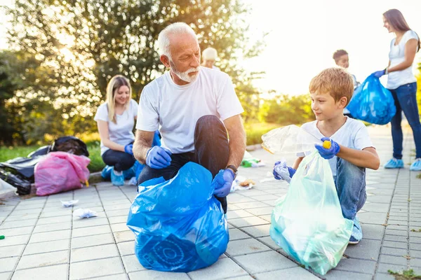 Volunteers Garbage Bags Cleaning Garbage Outdoors Ecology Concept Royalty Free Stock Photos