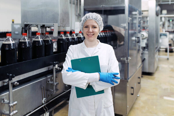 Young Happy Female Worker Bottling Factory Checking Juice Bottles Shipment Stock Photo