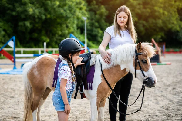 Cute Little Girl Her Older Sister Enjoying Pony Horse Outdoors Royalty Free Stock Images