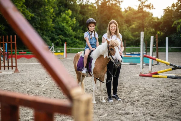 Cute Little Girl Her Older Sister Enjoying Pony Horse Outdoors Royalty Free Stock Photos