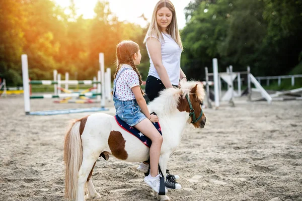 Cute Little Girl Her Older Sister Enjoying Pony Horse Outdoors Royalty Free Stock Photos