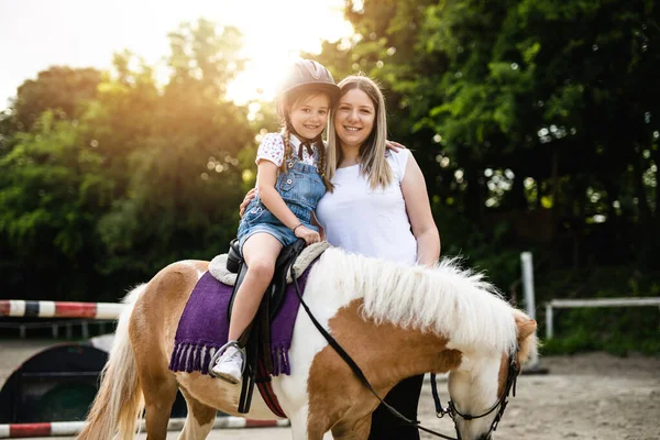 Cute Little Girl Her Older Sister Enjoying Pony Horse Outdoors Royalty Free Stock Photos