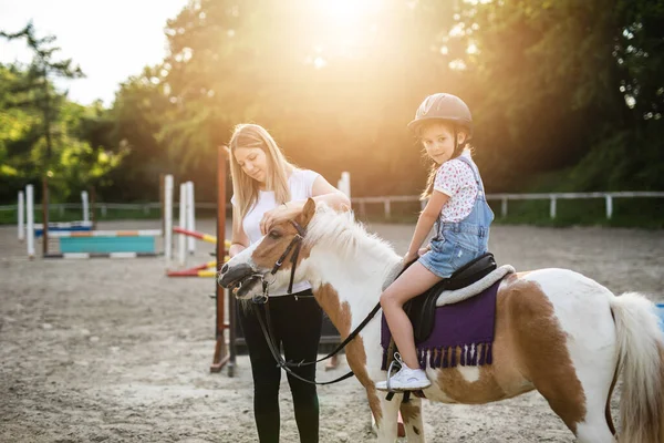 Cute Little Girl Her Older Sister Enjoying Pony Horse Outdoors Stock Picture