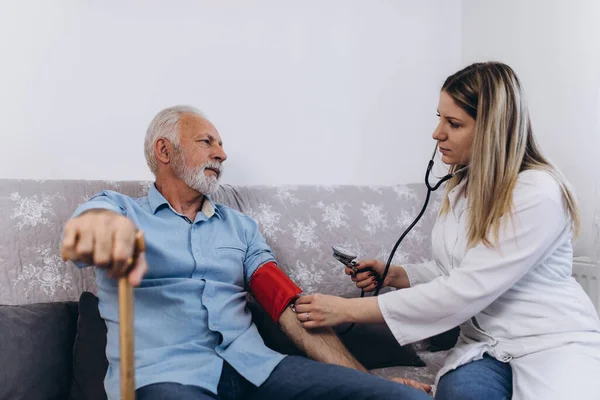 Young Positive Caregiver Taking Care Senior Man Nursing Home Stock Picture