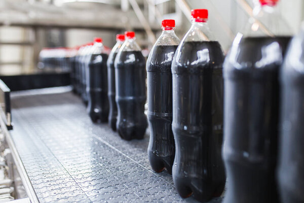 Bottling Factory Black Juice Bottling Line Processing Bottling Juice Bottles Royalty Free Stock Images