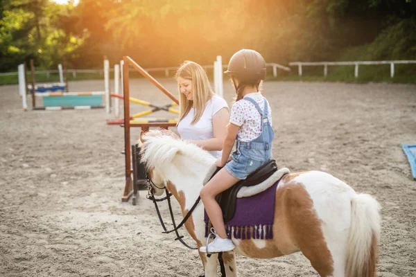 Cute Little Girl Her Older Sister Enjoying Pony Horse Outdoors Stock Photo