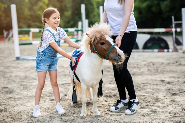 Cute Little Girl Her Older Sister Enjoying Pony Horse Outdoors Stock Image