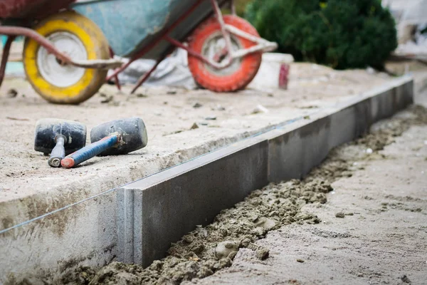 Installing Pavement Curb Level Rubber Hammers — Stock Photo, Image