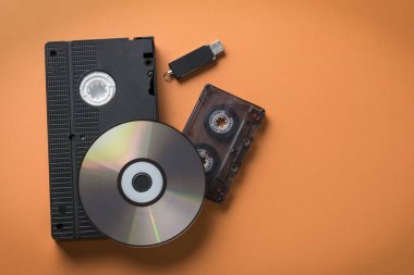 CD-ROM and video-audio cassette flash drive as a concept of media storage evolution. clipart