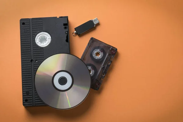 CD-ROM and video-audio cassette flash drive as a concept of media storage evolution.