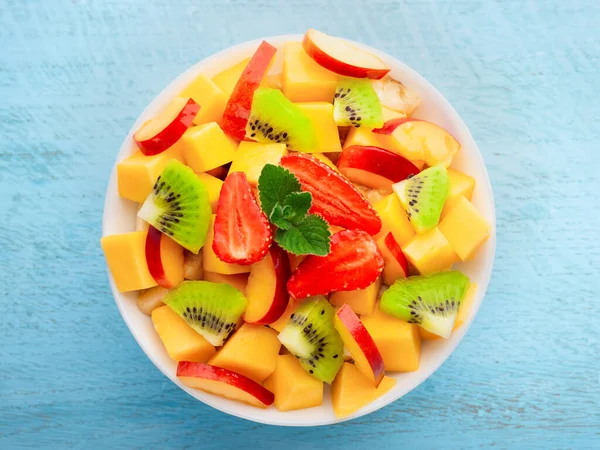 Fruit Salad Mango Strawberries Kiwi Peach Bowl Wooden Background Top — Stock Photo, Image